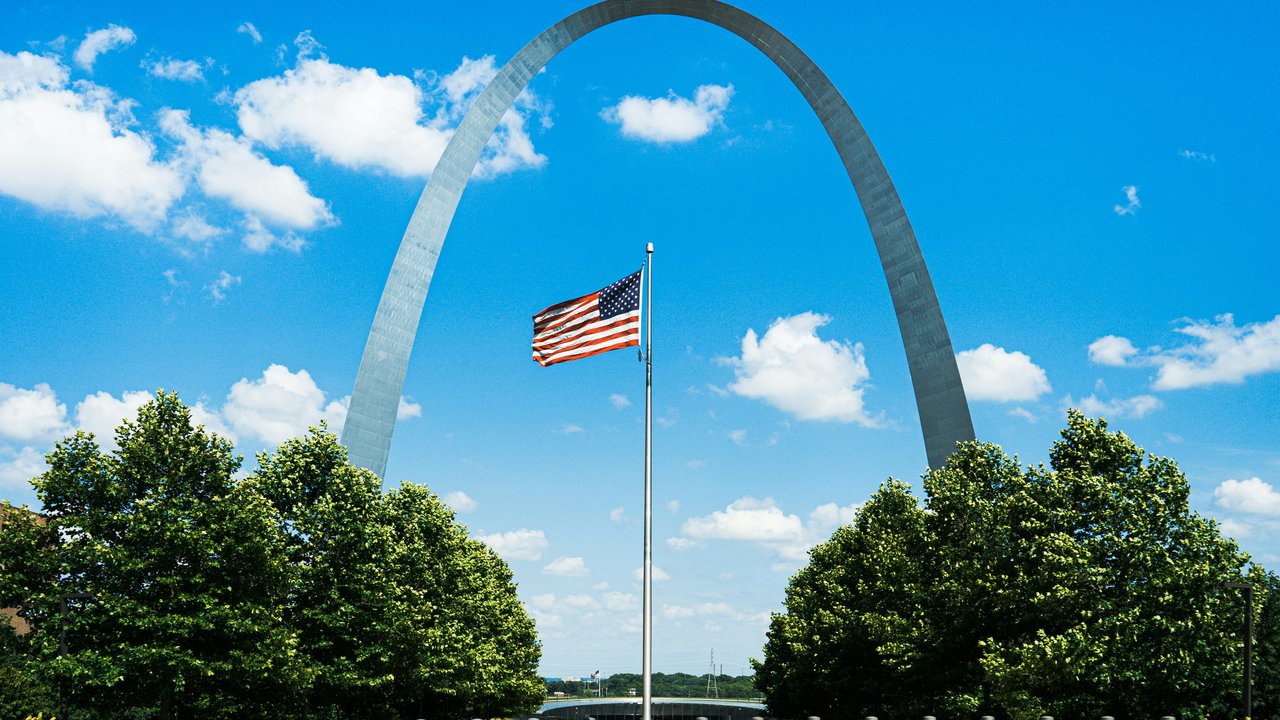 Gateway Arch and American flag in St. Louis Missouri