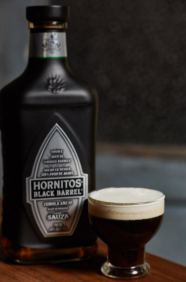 sláinte de la noche with hornitos black barrel tequila bottle