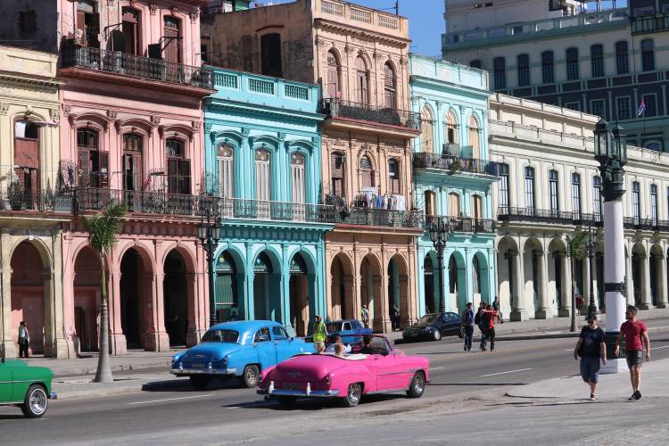 cuba has beautiful colors found on buildings and classic automobiles