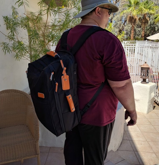 james wearing travel backpack