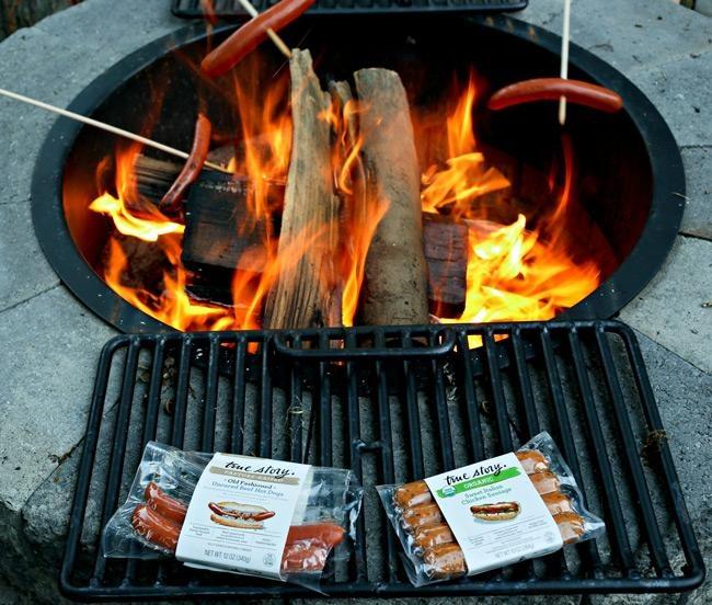roasting sausages over fire