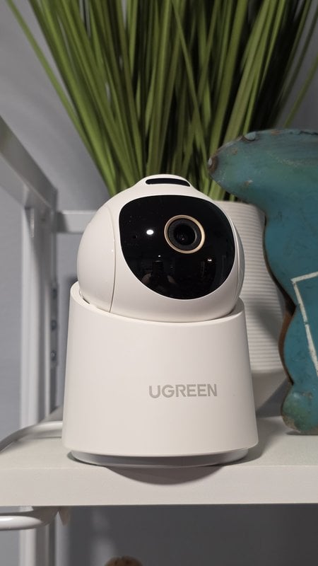 UGREEN SynCare indoor camera on a white shelf