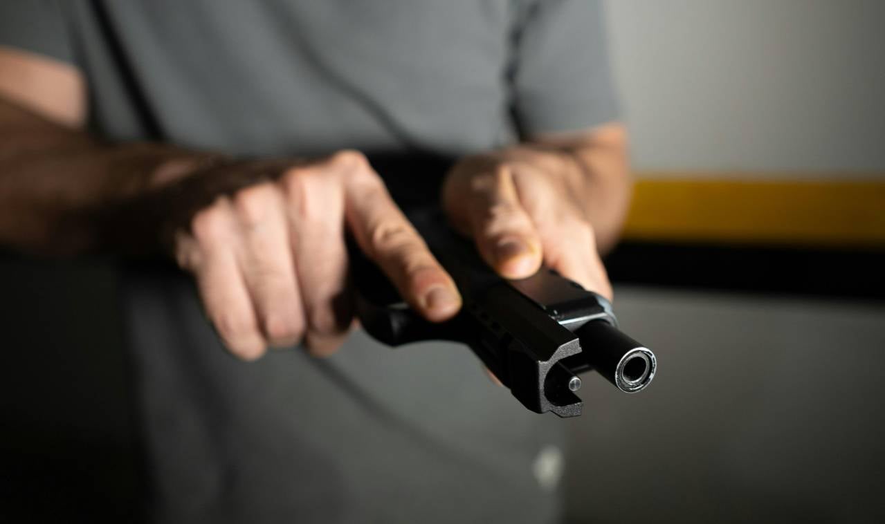 man testing out used gun
