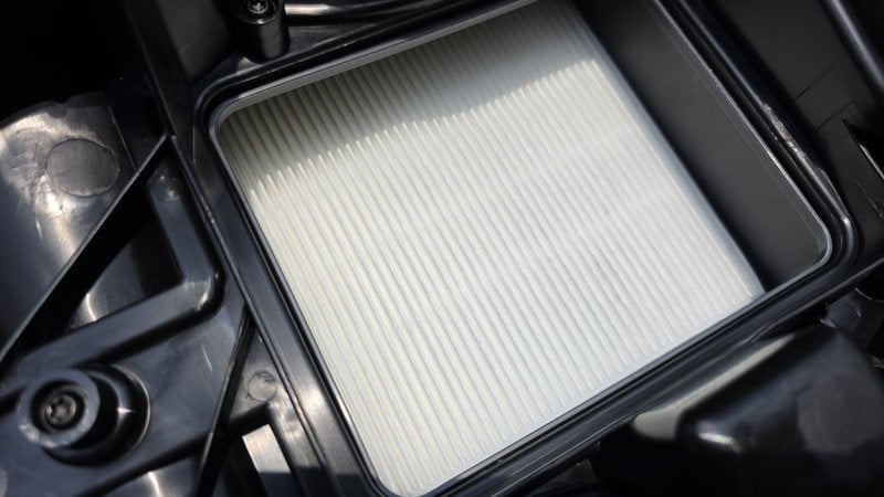 The flat HEPA material filter sitting in the FLT+ tray on top of the Vacmaster Beast powerhead