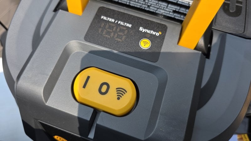 The Vacmaster Beast powerhead control panel showing the Synchro filter status display and the three position wireless switch