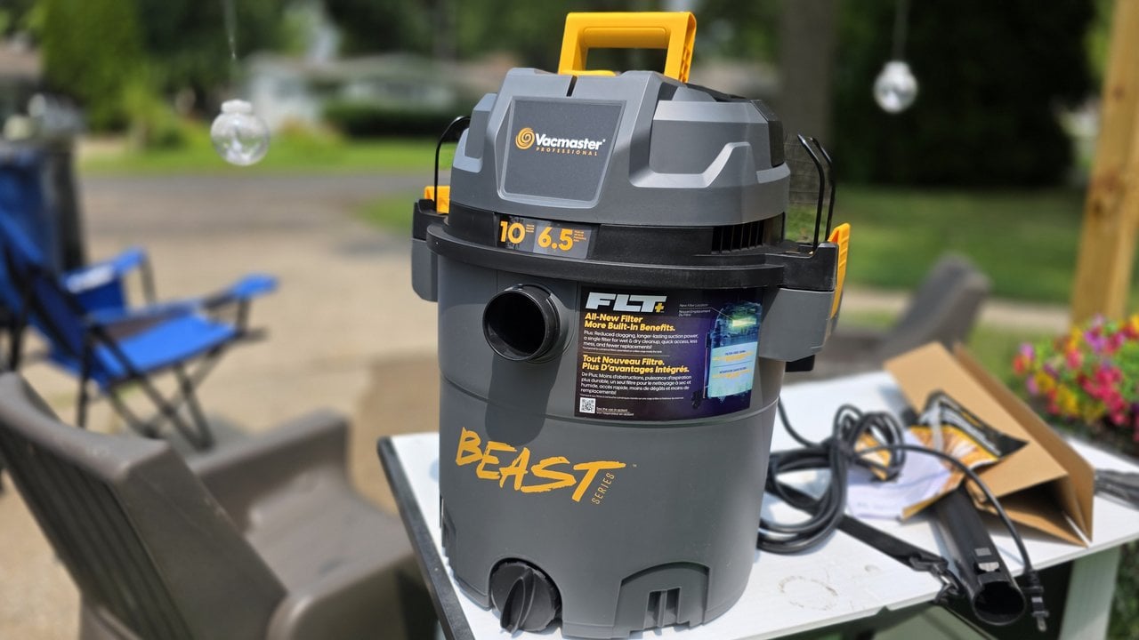 The Vacmaster Beast Series FLT+ 10-gallon wet dry vac set up outside on a work table
