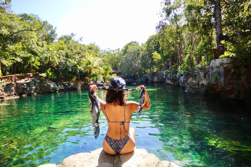 swimming in a cenote in Tulum, Riviera Maya, Mexico