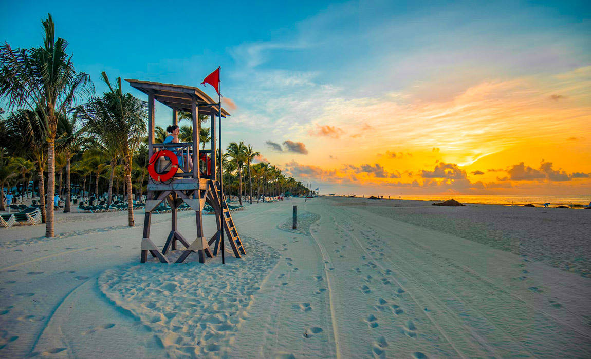 relaxing on a beach at sunrise in Riviera Maya Mexico