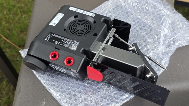 Back of the Weber Kettle Smart Ring controller showing the digital fan grille and two red probe ports