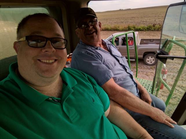 james in a soybean harvester