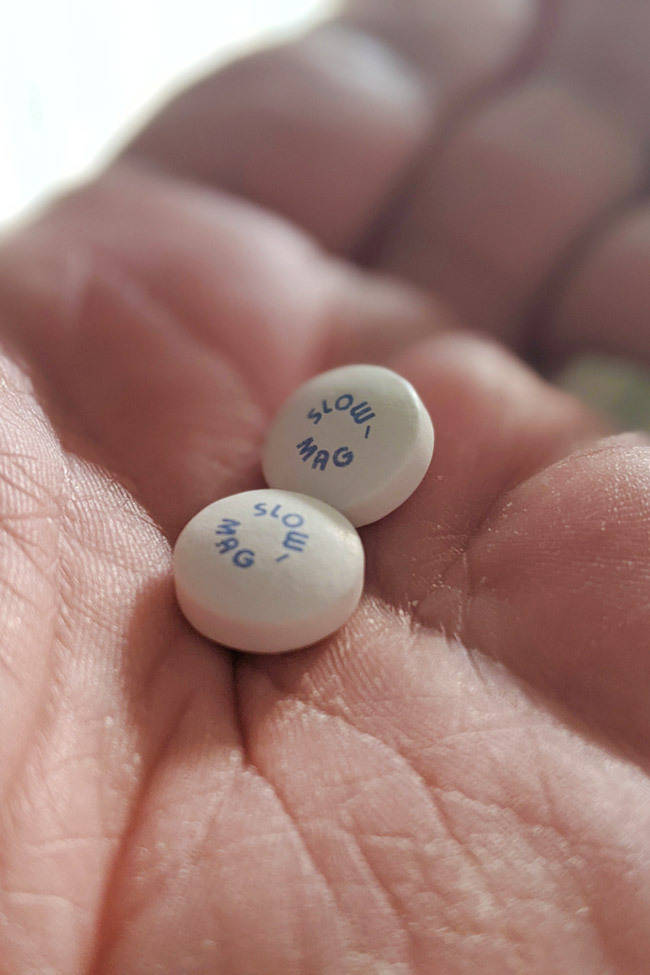 slow mg tablets in hand