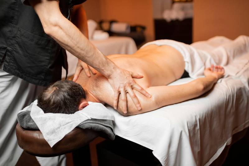man getting a massage by a therapist