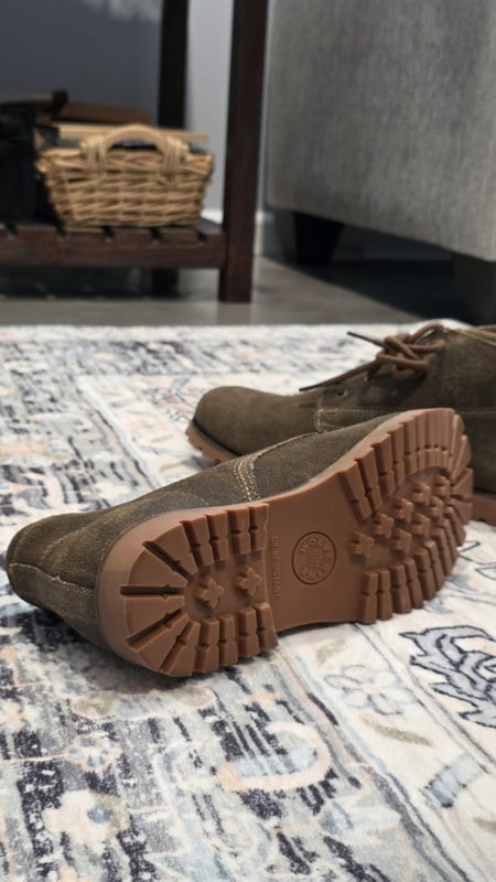 Bottom of Wolverine 1000 Mile Legacy Cort Boot showing the rubber lug outsole tread pattern with Wolverine SINCE 1883 stamp and OIL RESISTANT marking