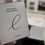 Holding the reMarkable Paper Pure showing the Better paper. Better thinking. welcome screen