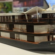 Scale model of the Zafiro Amazon riverboat on display at a travel trade show