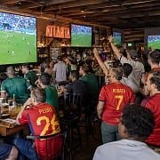 Soccer fans in Spain jerseys watch Spain vs Saudi Arabia on big screens at an Atlanta sports bar during the World Cup
