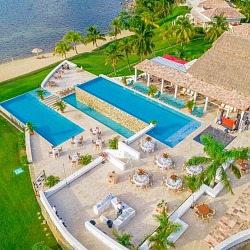 Aerial view of the beachfront pool deck at Las Verandas Hotel and Villas in Roatán Honduras