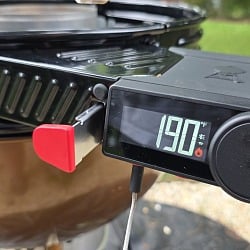 The Weber Kettle Smart Ring LCD controller mounted on a copper Weber kettle and reading 190 degrees