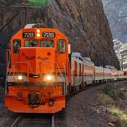 Royal Gorge Route Railroad locomotive 728 head on in the canyon with its headlights lit