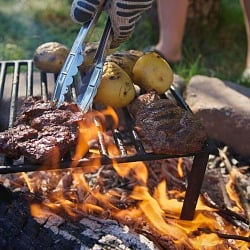grilling steaks and potatoes