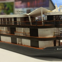 Scale model of the Zafiro Amazon riverboat on display at a travel trade show