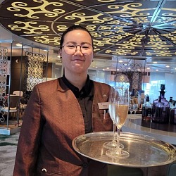 champagne host welcoming you to Celebrity Cruise