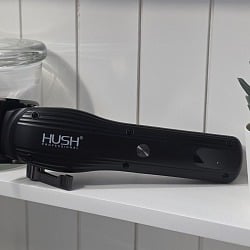 The HUSH Pro Clipper on a bathroom shelf