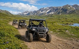 Guided Polaris side-by-sides on an alpine tundra trail at Hatcher Pass, Alaska
