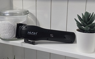 The HUSH Pro Clipper on a bathroom shelf