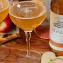 Kōloa Maple and Spice Apple Cider harvest cocktails with fresh apples and cinnamon sticks