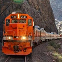 Royal Gorge Route Railroad locomotive 728 head on in the canyon with its headlights lit