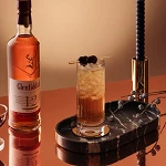 Glenfiddich Speyside Cobbler fall whiskey cocktail beside a bottle of Glenfiddich 12 Year Old Sherry Cask