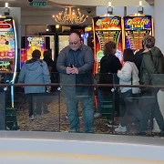James checking his phone outside the casino on Norwegian Getaway