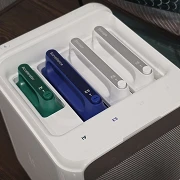 UGREEN HomeAgent HA100 seen from above with its four color-coded drive and accelerator sleds