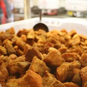 Cracklins are just one of the man-friendly foods you'll need to try when visiting Lafayette, Louisiana on a guys weekend.