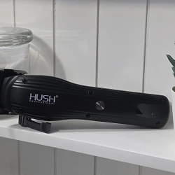 The HUSH Pro Clipper on a bathroom shelf